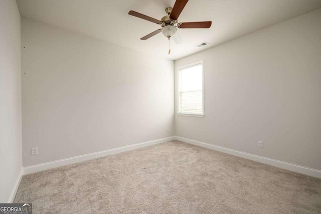 2856 Knob Creek Dr, Snellville, GA 30078 - carpeted spare room featuring baseboards and a ceiling fan