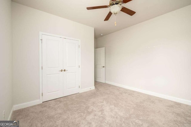 2856 Knob Creek Dr, Snellville, GA 30078 - unfurnished bedroom featuring carpet, baseboards, a closet, and ceiling fan