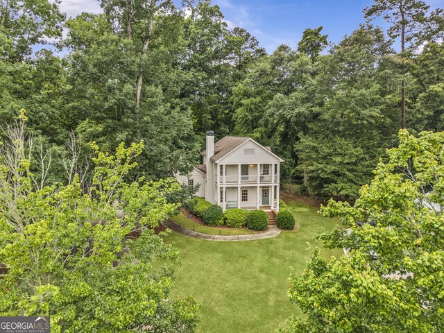 775 Markhams Dr, Madison, GA 30650 - view from above of property with a forest