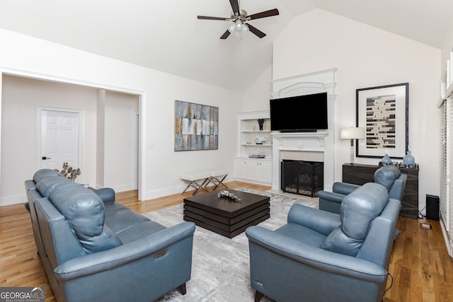 720 Latrobe Way, Macon, GA 31220 - living room featuring a ceiling fan, a fireplace with flush hearth, high vaulted ceiling, and light wood-type flooring