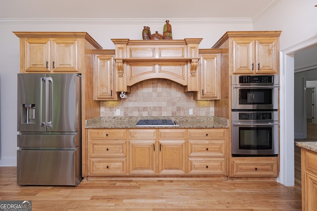 720 Latrobe Way, Macon, GA 31220 - kitchen with appliances with stainless steel finishes, light stone countertops, light wood finished floors, tasteful backsplash, and crown molding