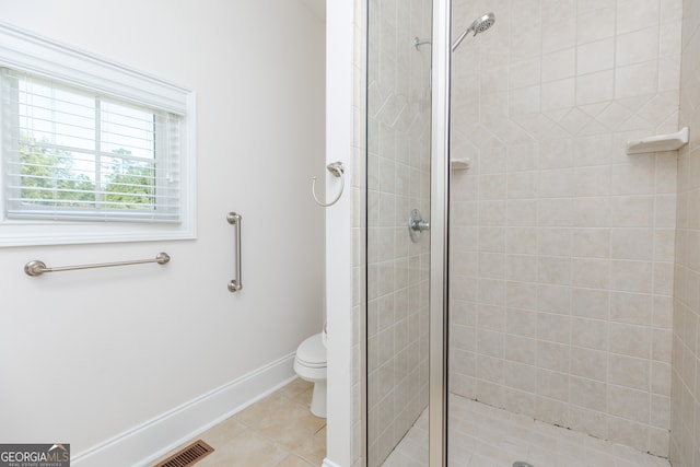 720 Latrobe Way, Macon, GA 31220 - full bath featuring a stall shower, toilet, tile patterned floors, and baseboards