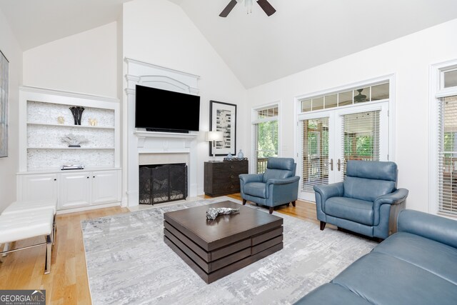 720 Latrobe Way, Macon, GA 31220 - living room with a ceiling fan, light wood-style floors, a fireplace with flush hearth, high vaulted ceiling, and built in features