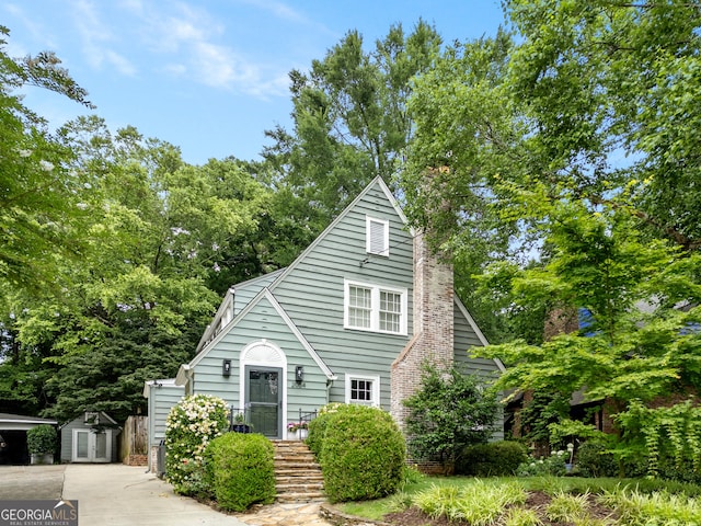 2054 Palifox Dr NE, Atlanta, GA 30307 - view of front facade featuring a chimney and view of scattered trees