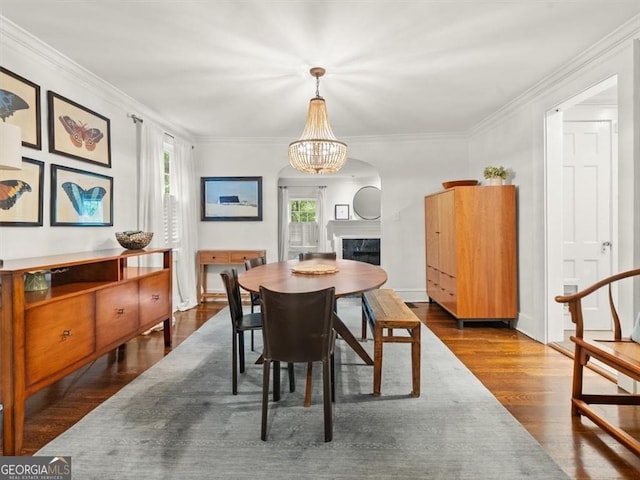 2054 Palifox Dr NE, Atlanta, GA 30307 - dining room featuring dark wood finished floors, a chandelier, a high end fireplace, and crown molding