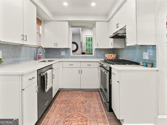 2054 Palifox Dr NE, Atlanta, GA 30307 - kitchen featuring stainless steel appliances, under cabinet range hood, a sink, white cabinetry, and recessed lighting