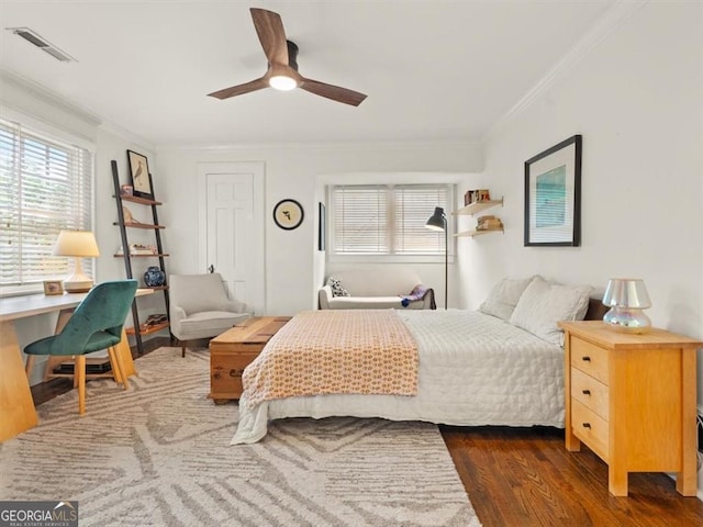 2054 Palifox Dr NE, Atlanta, GA 30307 - bedroom featuring crown molding, multiple windows, wood finished floors, and ceiling fan