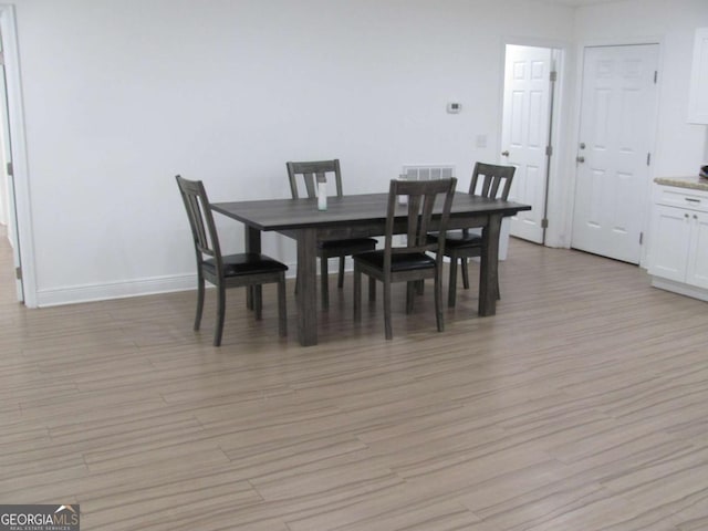 115 Red Hawk Ct, Waynesville, GA 31566 - dining space with light wood-type flooring and baseboards
