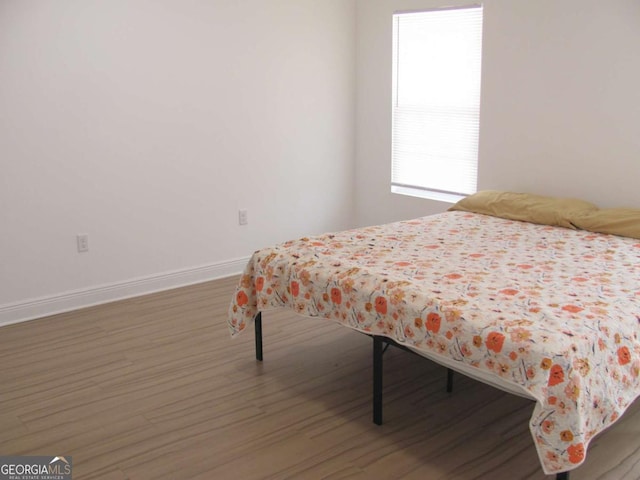 115 Red Hawk Ct, Waynesville, GA 31566 - bedroom with wood finished floors and baseboards