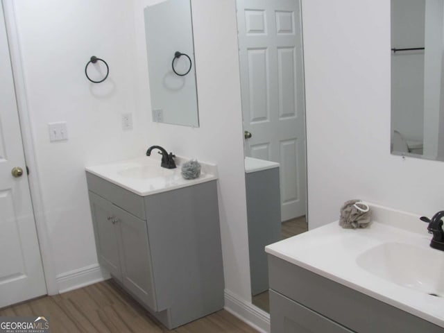 115 Red Hawk Ct, Waynesville, GA 31566 - bathroom with two vanities and wood finished floors