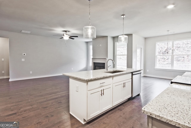 4063 Links Blvd, Jefferson, GA 30549 - kitchen with a sink, stainless steel dishwasher, open floor plan, a ceiling fan, and a fireplace