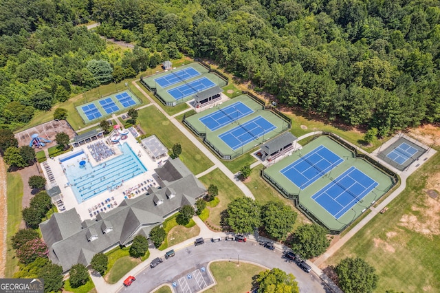 4063 Links Blvd, Jefferson, GA 30549 - drone / aerial view of a pool area and a heavily wooded area