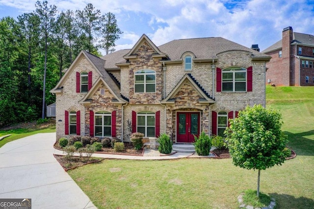 332 Warwick Pl, Mcdonough, GA 30253 - view of front of home with french doors, a front yard, brick siding, and stone siding