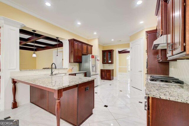 332 Warwick Pl, Mcdonough, GA 30253 - kitchen featuring a sink, white refrigerator with ice dispenser, under cabinet range hood, recessed lighting, and a peninsula