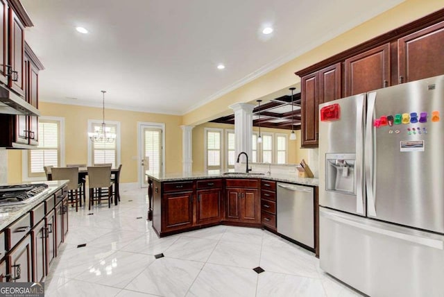 332 Warwick Pl, Mcdonough, GA 30253 - kitchen with appliances with stainless steel finishes, a sink, a peninsula, crown molding, and ornate columns