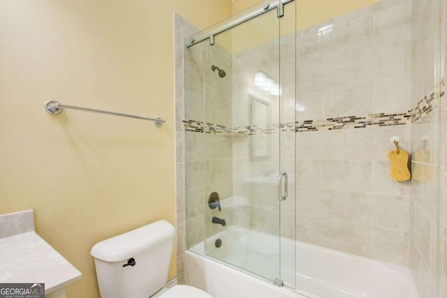 332 Warwick Pl, Mcdonough, GA 30253 - bathroom featuring toilet, bath / shower combo with glass door, and vanity
