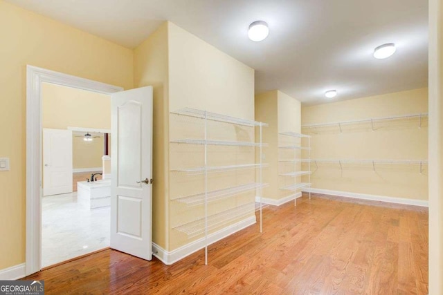 332 Warwick Pl, Mcdonough, GA 30253 - spacious closet featuring wood finished floors