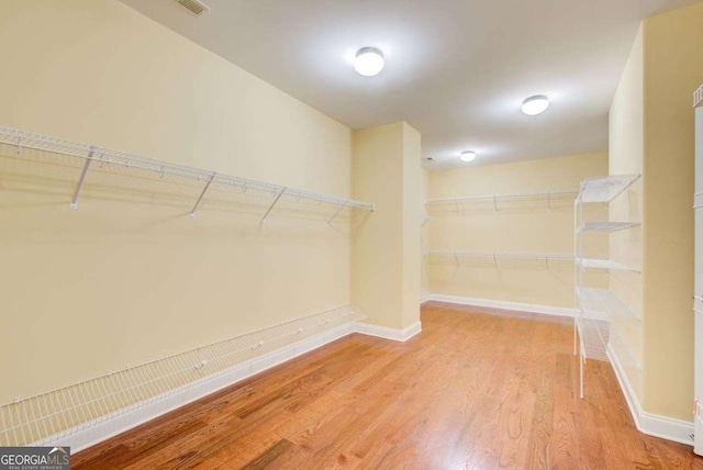 332 Warwick Pl, Mcdonough, GA 30253 - walk in closet featuring wood finished floors