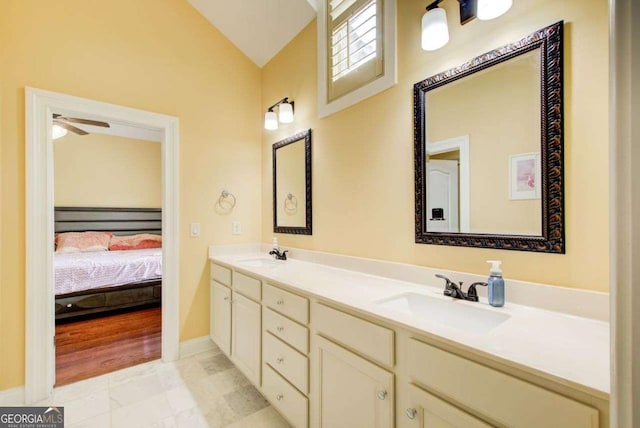 332 Warwick Pl, Mcdonough, GA 30253 - ensuite bathroom with vaulted ceiling, double vanity, marble finish floors, ceiling fan, and baseboards