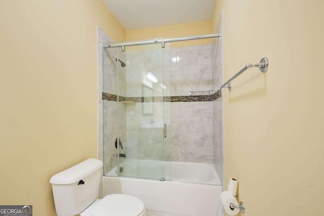 332 Warwick Pl, Mcdonough, GA 30253 - bathroom with toilet and shower / bath combination with glass door