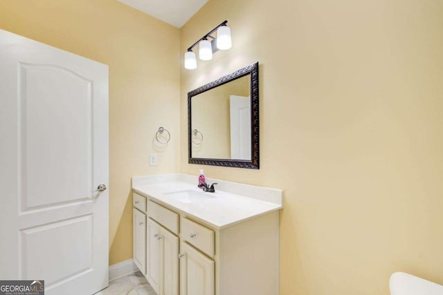 332 Warwick Pl, Mcdonough, GA 30253 - bathroom featuring vanity, toilet, and baseboards