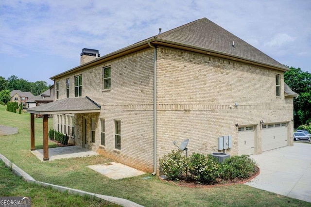 332 Warwick Pl, Mcdonough, GA 30253 - rear view of property featuring a chimney, brick siding, a yard, and driveway