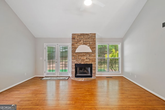 2623 Lone Oak Trl NW, Kennesaw, GA 30144 - unfurnished living room featuring vaulted ceiling, ceiling fan, wood finished floors, a fireplace, and baseboards