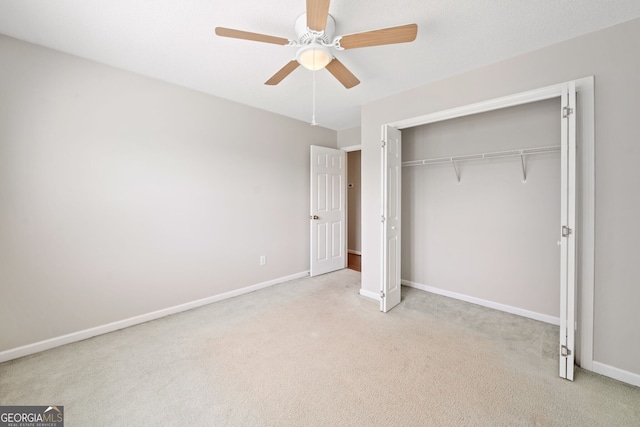 2623 Lone Oak Trl NW, Kennesaw, GA 30144 - unfurnished bedroom with carpet flooring, baseboards, a closet, and a ceiling fan