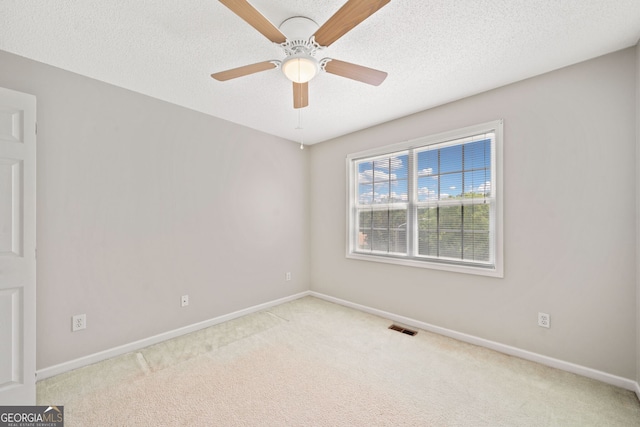 2623 Lone Oak Trl NW, Kennesaw, GA 30144 - carpeted spare room with baseboards, a ceiling fan, and a textured ceiling