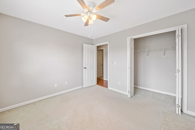 2623 Lone Oak Trl NW, Kennesaw, GA 30144 - unfurnished bedroom featuring carpet, baseboards, a closet, and ceiling fan