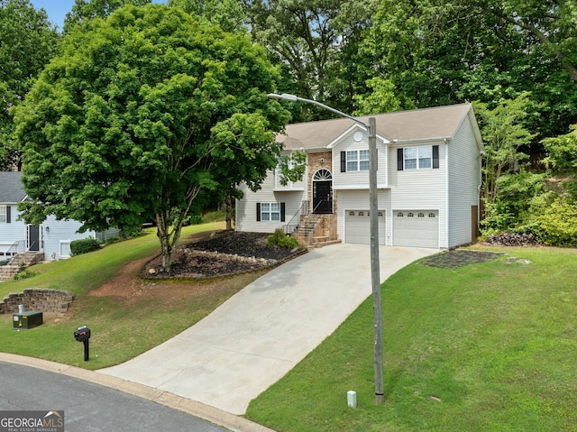 2623 Lone Oak Trl NW, Kennesaw, GA 30144 - bi-level home featuring concrete driveway, a garage, a front yard, and stairway