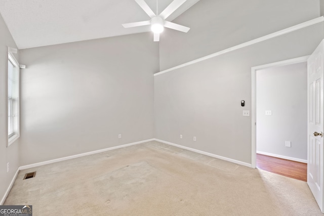 2623 Lone Oak Trl NW, Kennesaw, GA 30144 - unfurnished room featuring light carpet, ceiling fan, lofted ceiling, and baseboards