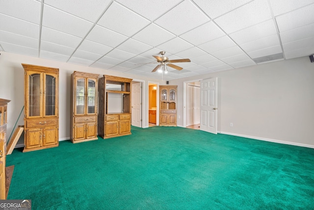 2623 Lone Oak Trl NW, Kennesaw, GA 30144 - unfurnished living room featuring baseboards, a paneled ceiling, dark carpet, and a ceiling fan