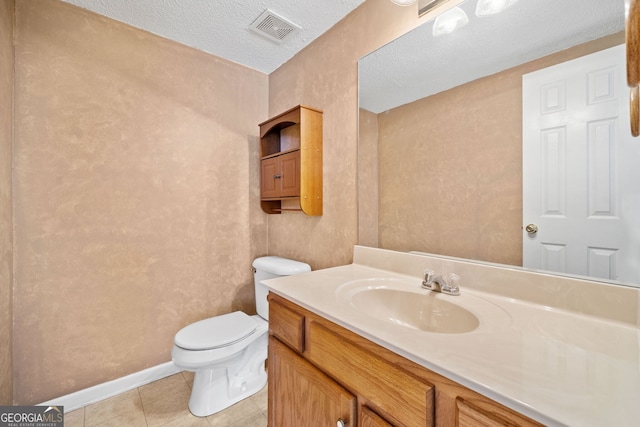2623 Lone Oak Trl NW, Kennesaw, GA 30144 - bathroom featuring toilet, vanity, tile patterned floors, baseboards, and a textured ceiling