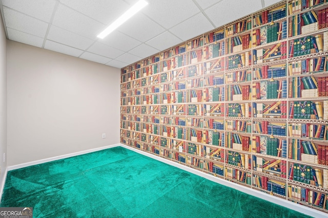 2623 Lone Oak Trl NW, Kennesaw, GA 30144 - spare room featuring a paneled ceiling, carpet floors, and baseboards