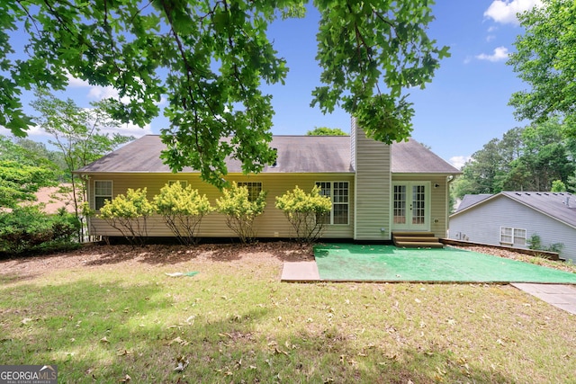 2623 Lone Oak Trl NW, Kennesaw, GA 30144 - ranch-style house featuring french doors, a front lawn, and a chimney