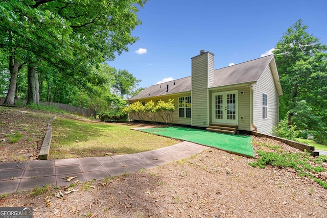 2623 Lone Oak Trl NW, Kennesaw, GA 30144 - rear view of house featuring french doors, a chimney, a lawn, and entry steps