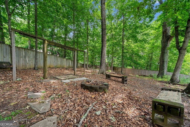 2623 Lone Oak Trl NW, Kennesaw, GA 30144 - fenced backyard featuring a fire pit