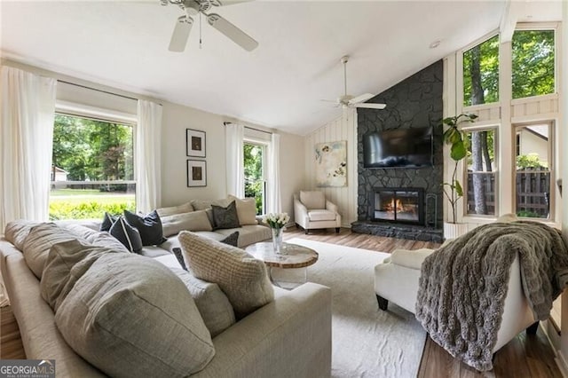 171 N Trce, Alpharetta, GA 30009 - living area with ceiling fan, wood finished floors, a stone fireplace, and high vaulted ceiling
