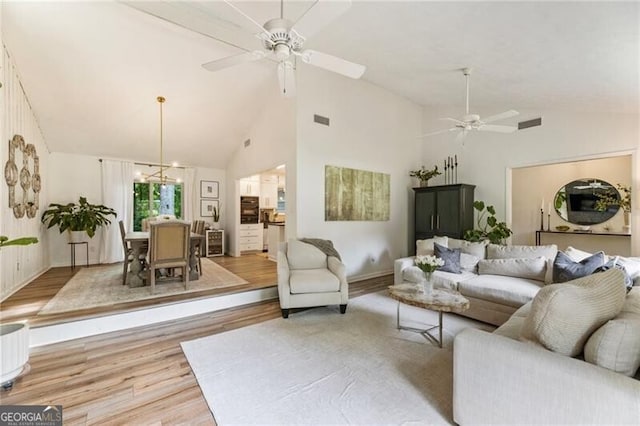 171 N Trce, Alpharetta, GA 30009 - living room featuring ceiling fan, wood finished floors, high vaulted ceiling, and baseboards