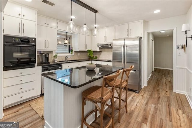 171 N Trce, Alpharetta, GA 30009 - kitchen featuring stainless steel appliances, under cabinet range hood, a sink, white cabinetry, and tasteful backsplash