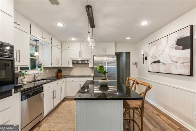 171 N Trce, Alpharetta, GA 30009 - kitchen featuring stainless steel appliances, under cabinet range hood, white cabinetry, light wood-style flooring, and recessed lighting
