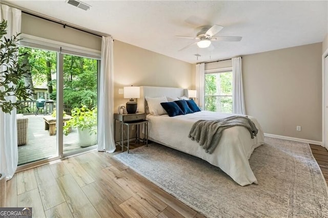 171 N Trce, Alpharetta, GA 30009 - bedroom featuring wood finished floors, access to outside, a ceiling fan, and baseboards