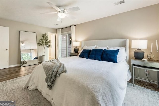 171 N Trce, Alpharetta, GA 30009 - bedroom with wood finished floors, a ceiling fan, and baseboards