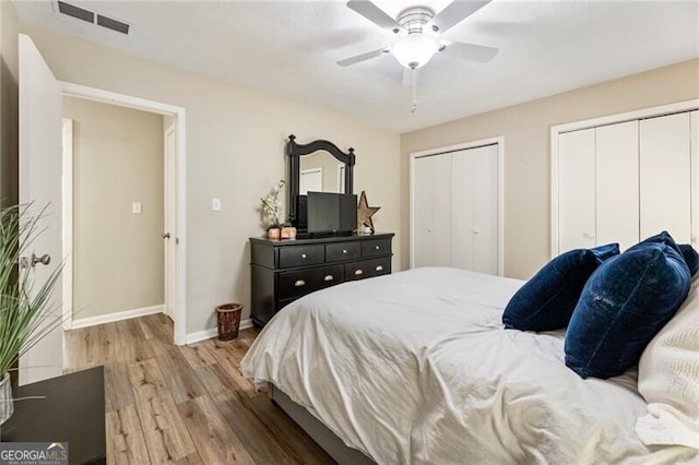 171 N Trce, Alpharetta, GA 30009 - bedroom with wood finished floors, multiple closets, baseboards, and a ceiling fan
