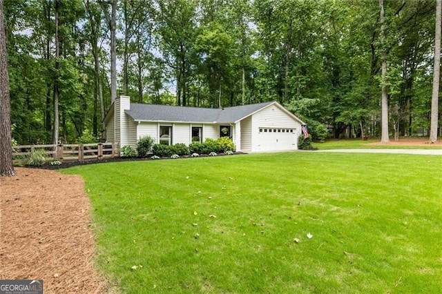 171 N Trce, Alpharetta, GA 30009 - view of front of property with an attached garage, a chimney, and driveway