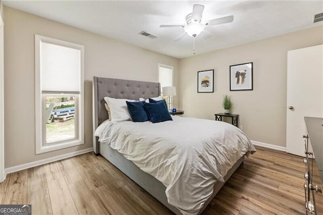 171 N Trce, Alpharetta, GA 30009 - bedroom with multiple windows, baseboards, and wood finished floors