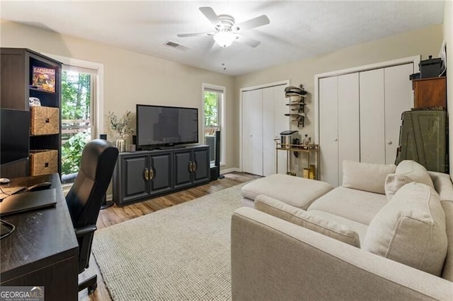 171 N Trce, Alpharetta, GA 30009 - living area with light wood-style floors, a ceiling fan, and a desk