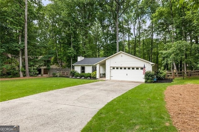 171 N Trce, Alpharetta, GA 30009 - view of front facade with a garage, driveway, a chimney, and view of wooded area