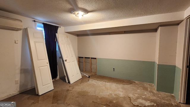 766 Virginia Cir, Forest Park, GA 30297 - below grade area with a wall unit AC and a textured ceiling